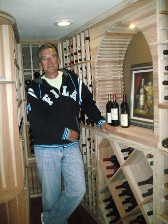 Small traditional wine cellar in Orange County with storage racks.