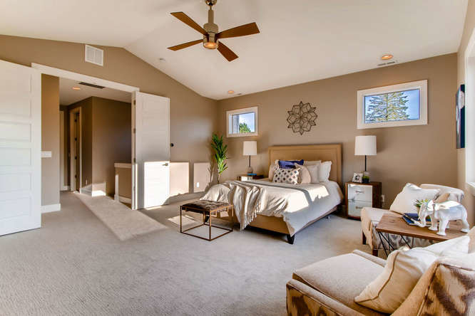Photo of a large contemporary master bedroom in Portland with grey walls, carpet and grey floor.