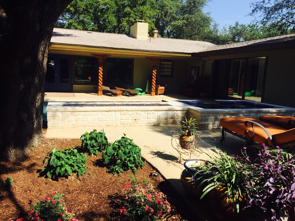 This is an example of a small transitional drought-tolerant and shade backyard concrete paver landscaping in Dallas with a fire pit for summer.