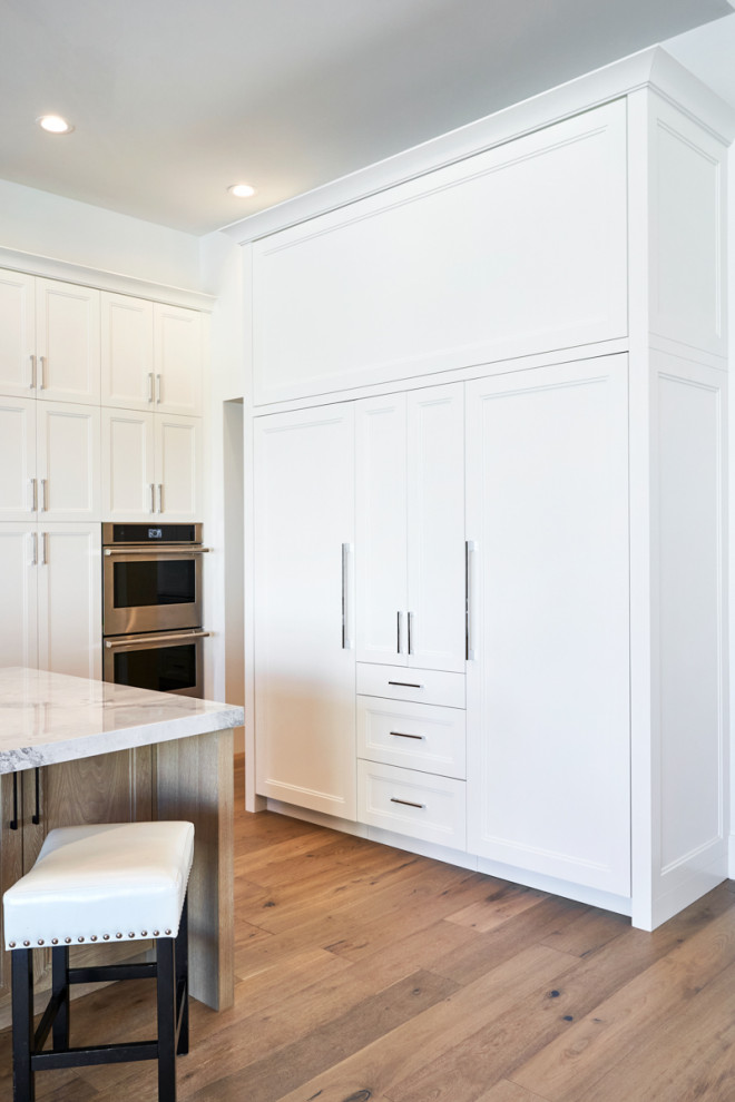 Transitional kitchen photo in Phoenix with shaker cabinets and white cabinets