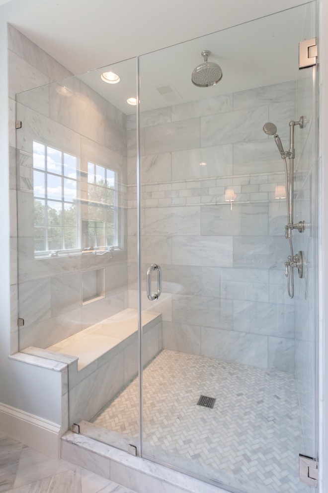 Inspiration for a traditional master bathroom in DC Metro with recessed-panel cabinets, grey cabinets, a freestanding tub, an alcove shower, gray tile, marble, blue walls, marble floors, an undermount sink, marble benchtops, grey floor, a hinged shower door and grey benchtops.