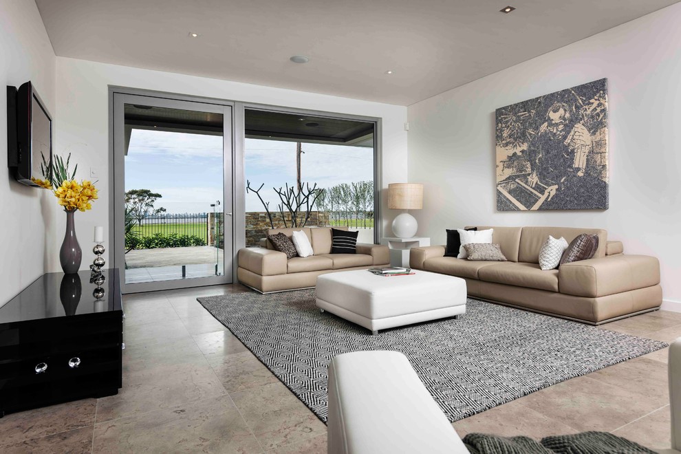 Design ideas for a contemporary open concept living room in Perth with white walls, a wall-mounted tv and travertine floors.