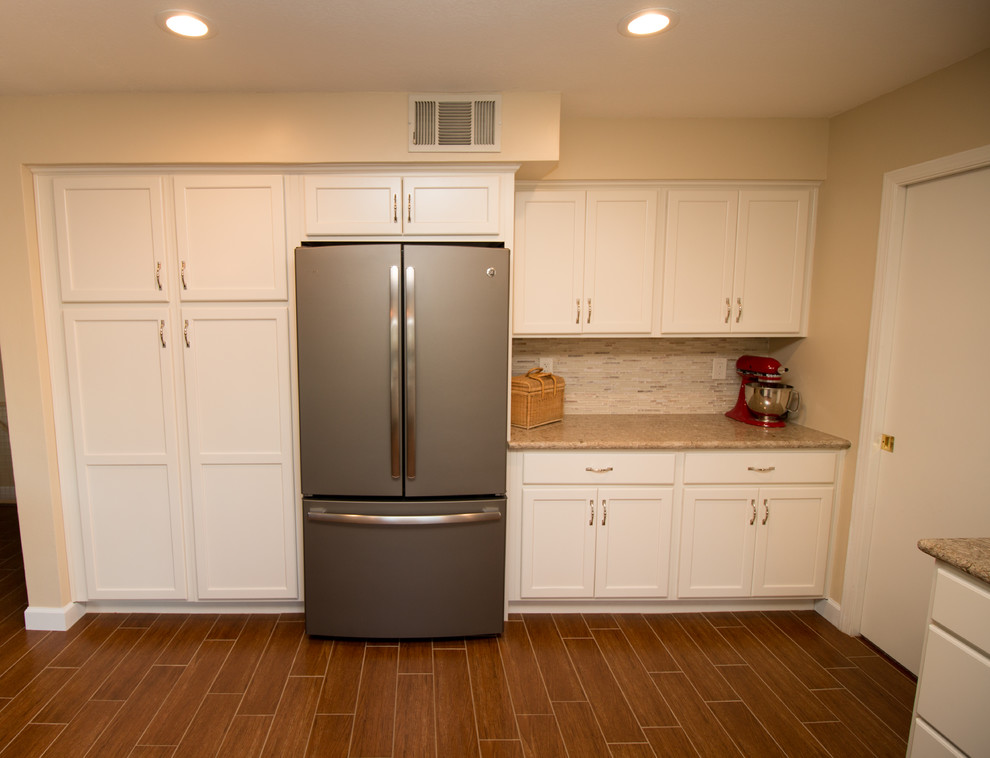 Inspiration for a mid-sized transitional u-shaped porcelain tile open concept kitchen remodel with an undermount sink, recessed-panel cabinets, beige cabinets, quartz countertops, beige backsplash, mosaic tile backsplash and colored appliances