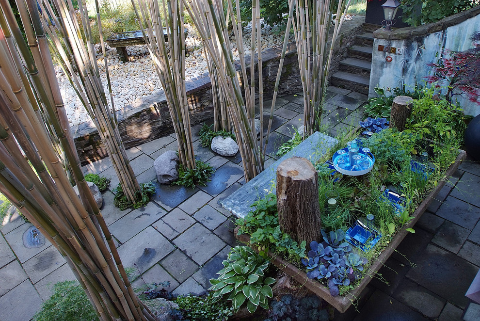 This is an example of an eclectic patio in Philadelphia with no cover.