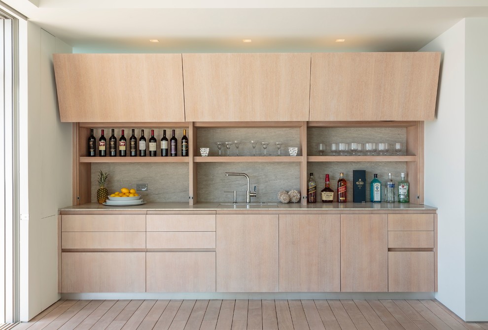 Large contemporary eat-in kitchen in Los Angeles with flat-panel cabinets, light wood cabinets and with island.