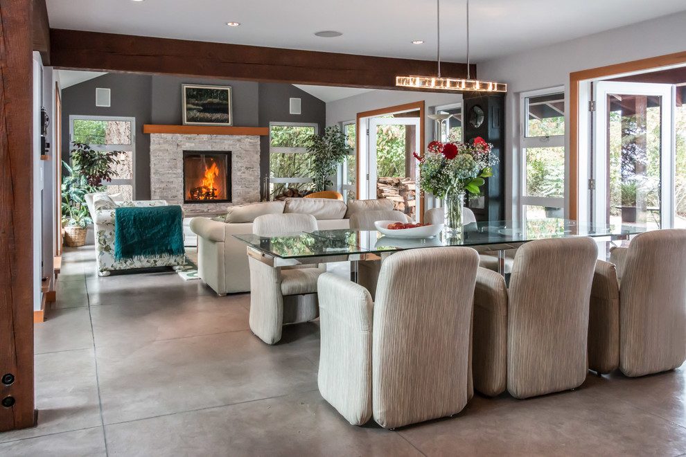 Inspiration for a mid-sized contemporary concrete floor and gray floor great room remodel in Vancouver with white walls