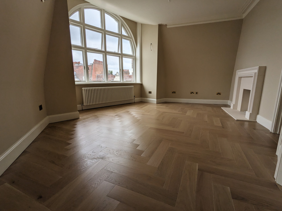 Photo of an expansive victorian living room in London with light hardwood flooring.