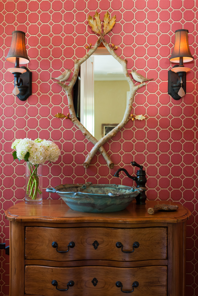 Traditional powder room in Other with a vessel sink and pink tile.
