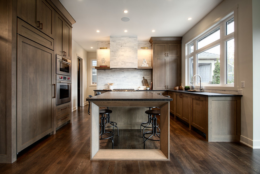 Example of a transitional kitchen design in Calgary