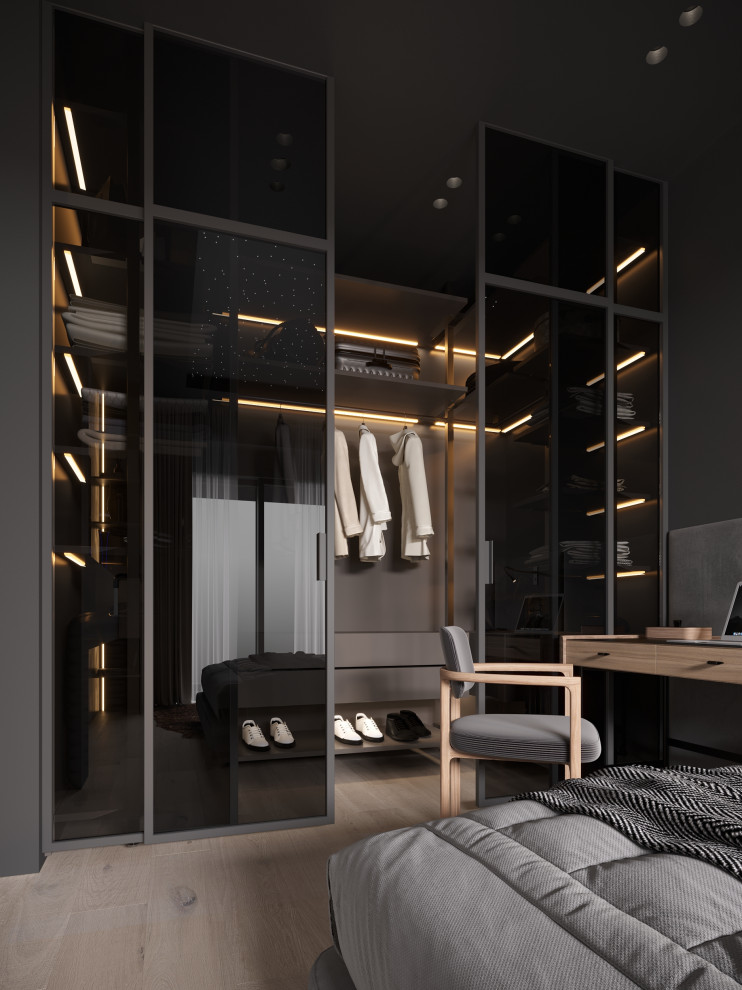 Mid-sized contemporary gender-neutral storage and wardrobe in Moscow with open cabinets, grey cabinets, laminate floors and brown floor.