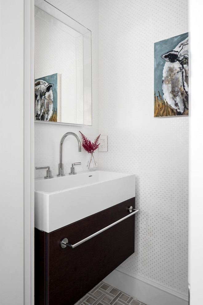 Photo of a small contemporary powder room in Boston with flat-panel cabinets, brown cabinets, white walls, ceramic floors, a console sink and multi-coloured floor.