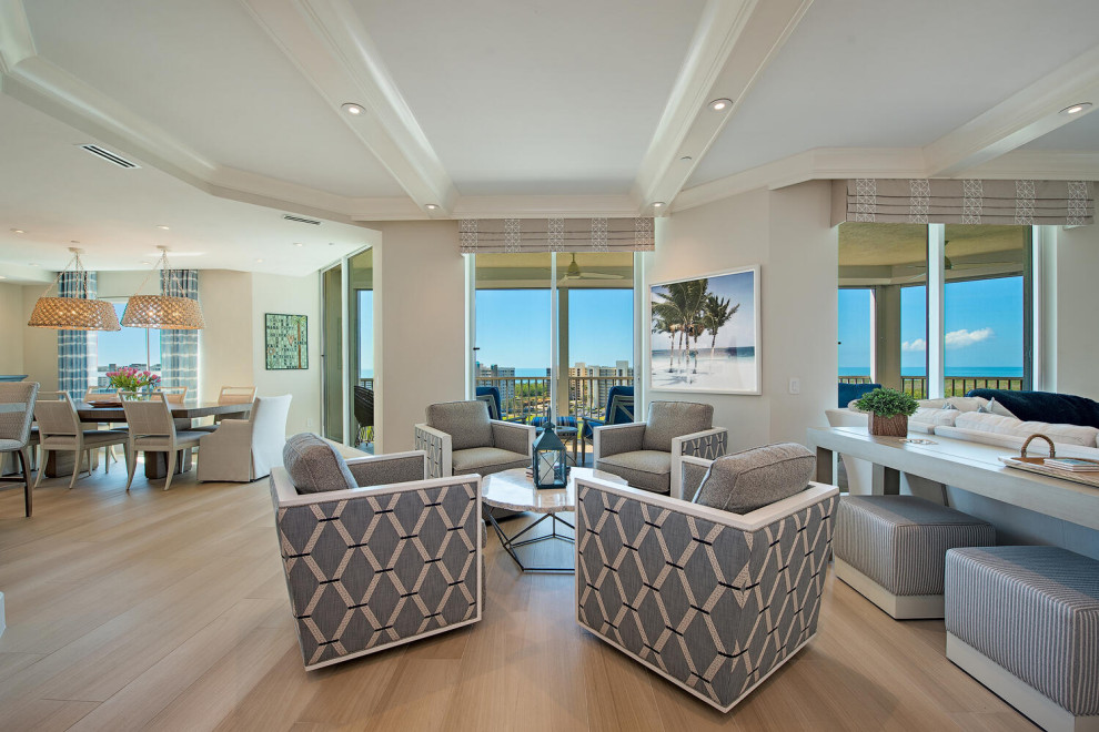 Inspiration for a large beach style living room in Miami with beige walls.