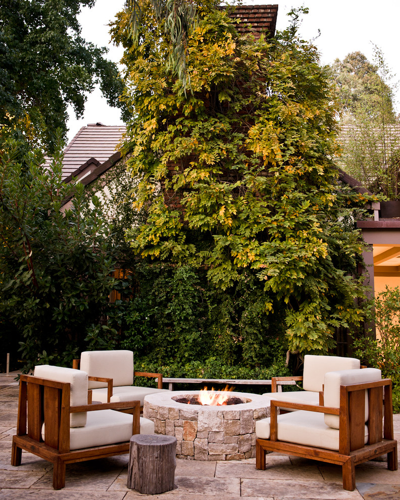 Design ideas for a contemporary patio in Los Angeles with a fire feature.