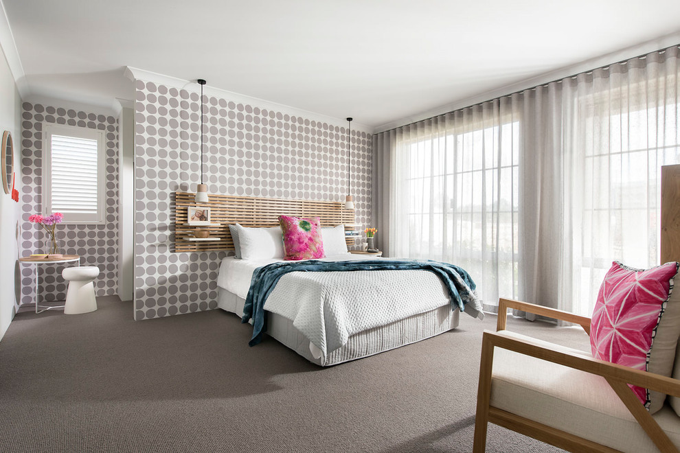 Photo of a mid-sized contemporary master bedroom in Perth with multi-coloured walls, carpet and grey floor.