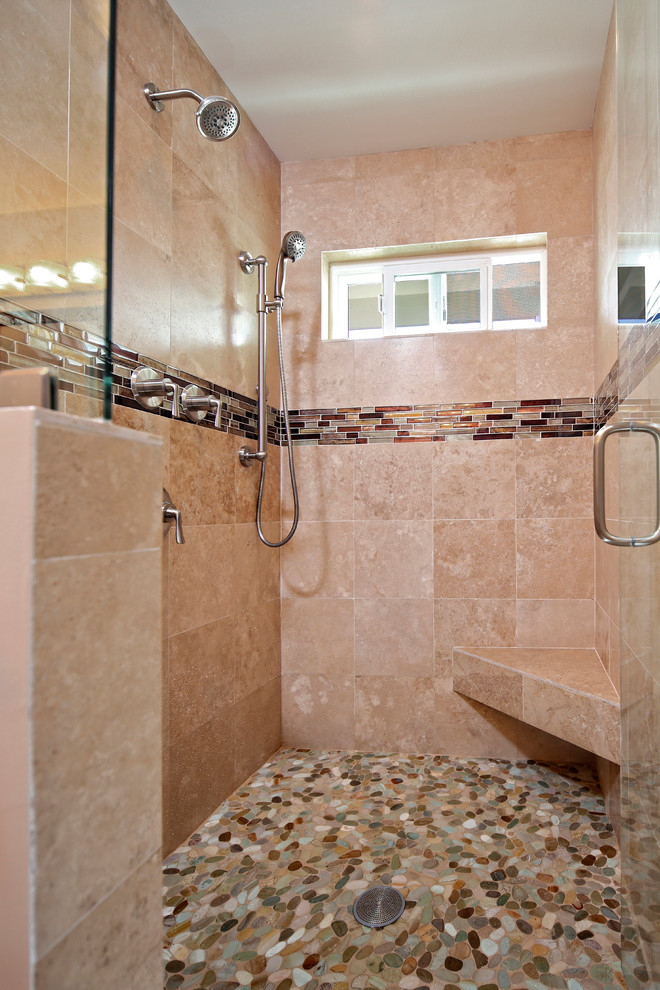 Inspiration for a mid-sized traditional 3/4 bathroom in Hawaii with shaker cabinets, medium wood cabinets, a one-piece toilet, beige tile, porcelain tile, white walls, porcelain floors, an undermount sink, engineered quartz benchtops, beige floor, an alcove shower and a hinged shower door.