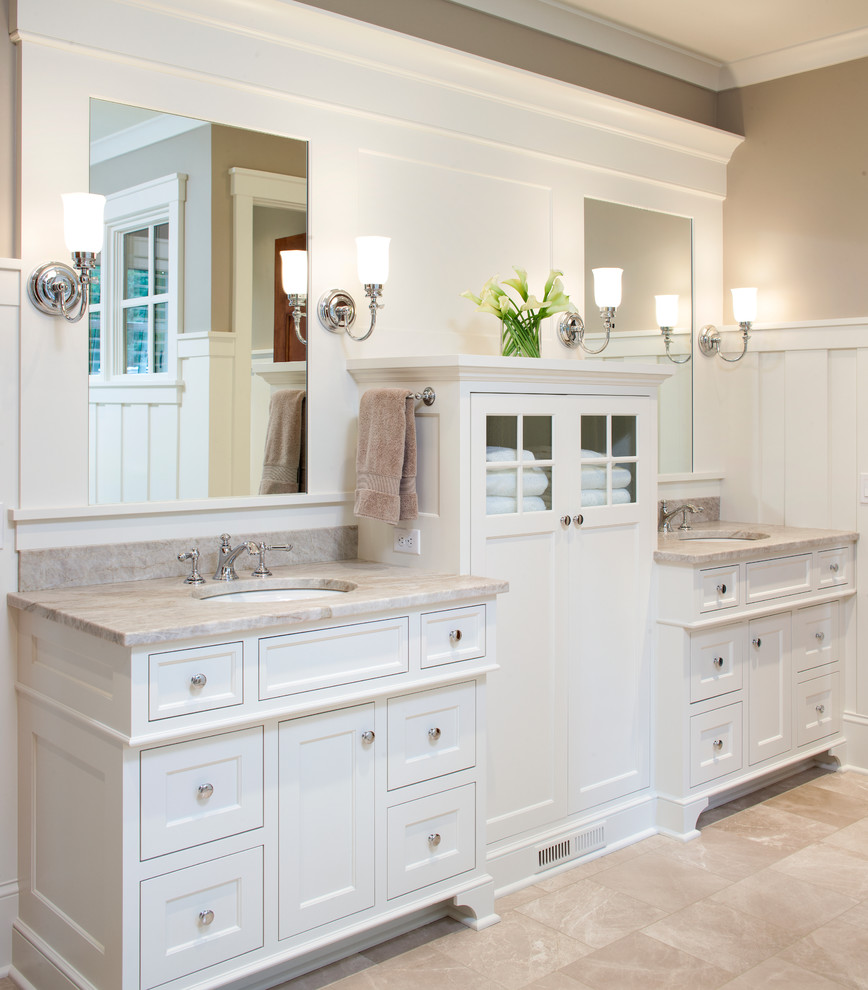 This is an example of a mid-sized traditional master bathroom in Minneapolis with white cabinets, a freestanding tub, a corner shower, beige tile, stone tile, beige walls, travertine floors, an undermount sink, granite benchtops, beige floor, a hinged shower door and beaded inset cabinets.