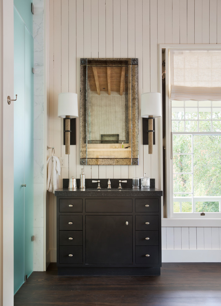 This is an example of a country bathroom in San Francisco with flat-panel cabinets, black cabinets, an alcove shower, white walls, dark hardwood floors, an undermount sink and a hinged shower door.