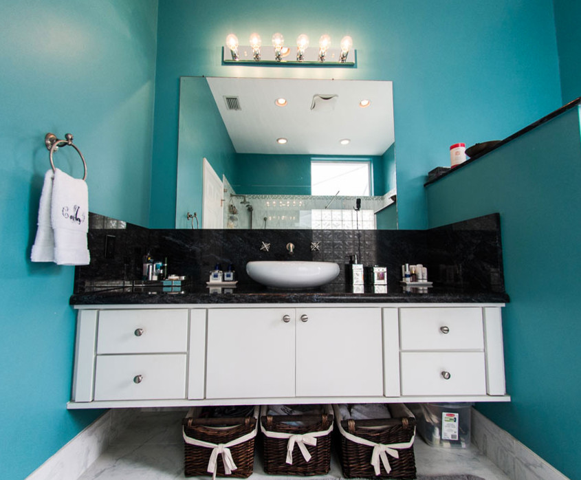Example of a mid-sized transitional 3/4 black tile bathroom design in Miami with flat-panel cabinets, white cabinets, blue walls and granite countertops