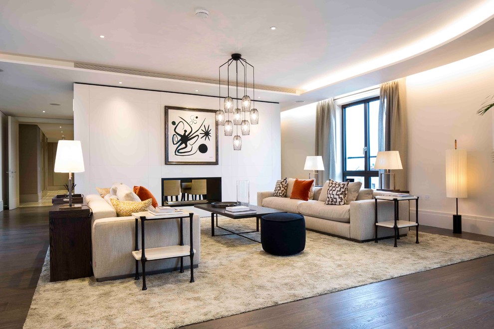 Photo of a mid-sized contemporary formal open concept living room in London with white walls and dark hardwood floors.