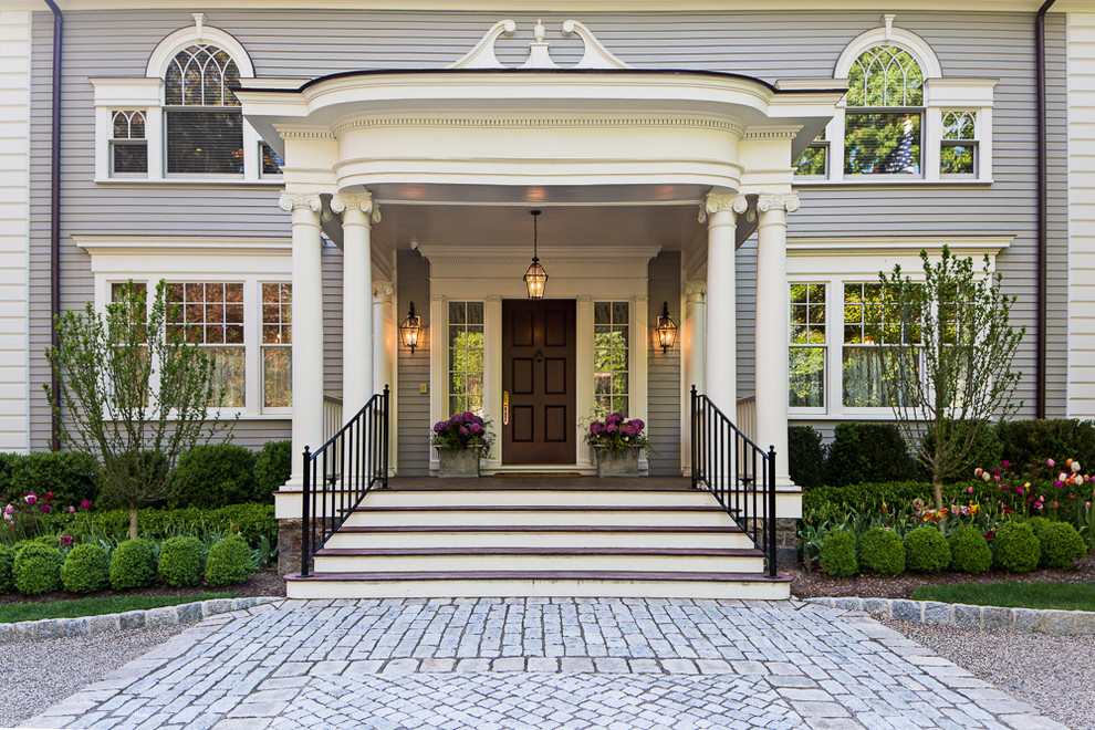 Inspiration for a large traditional front door in New York with a single front door and a dark wood front door.