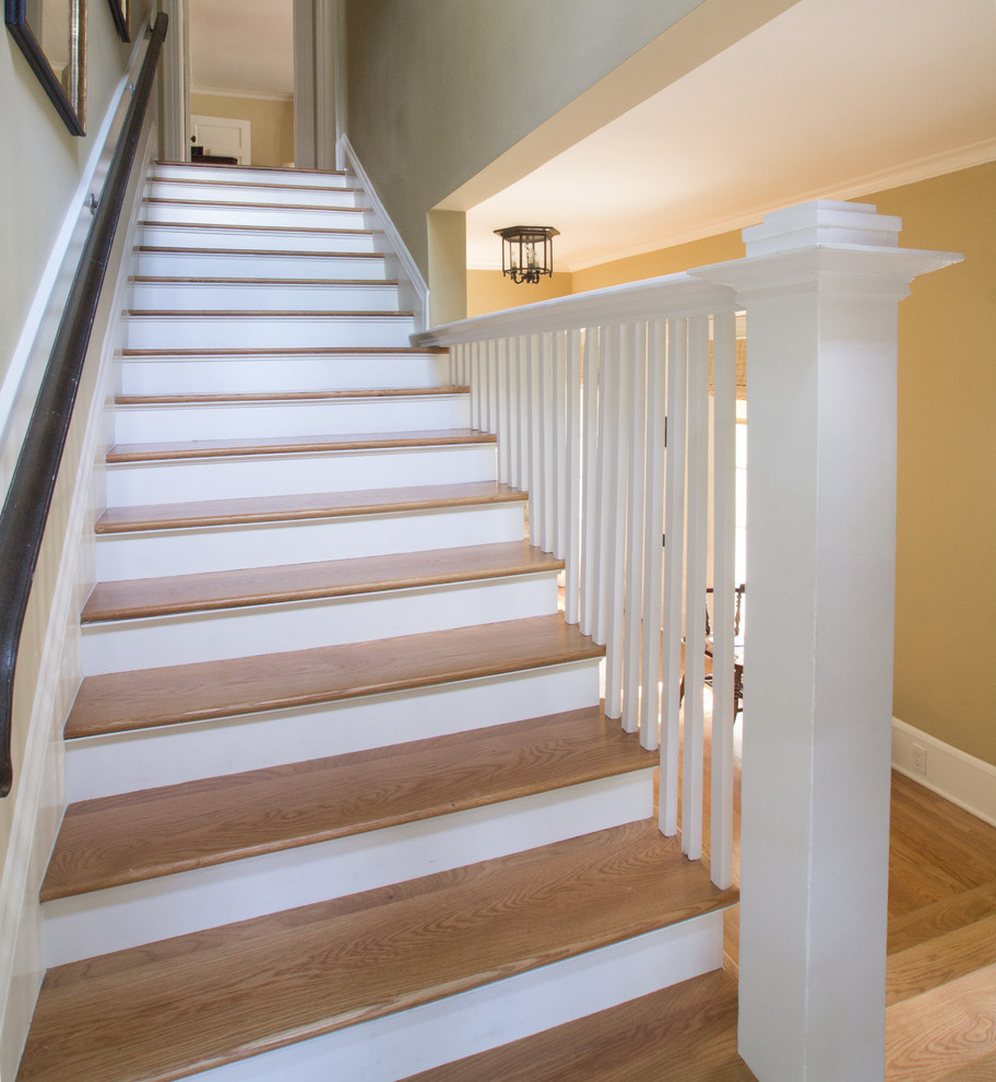 Design ideas for a large traditional wood straight staircase in Los Angeles with painted wood risers.