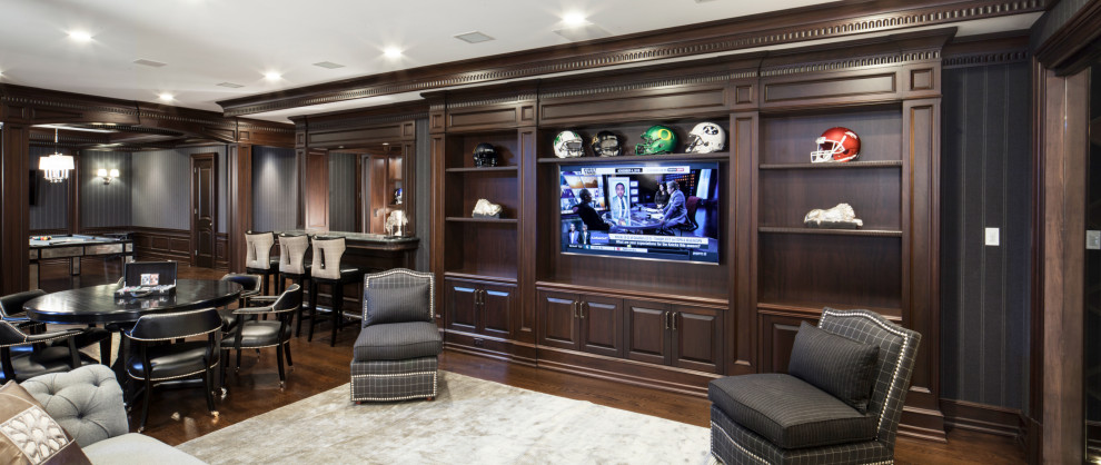 Inspiration for a large transitional look-out medium tone wood floor, brown floor and wallpaper basement remodel in New York with a home theater, gray walls and no fireplace