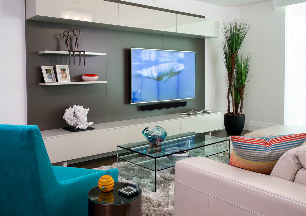 Photo of a mid-sized contemporary open concept living room in Miami with white walls, porcelain floors and a built-in media wall.