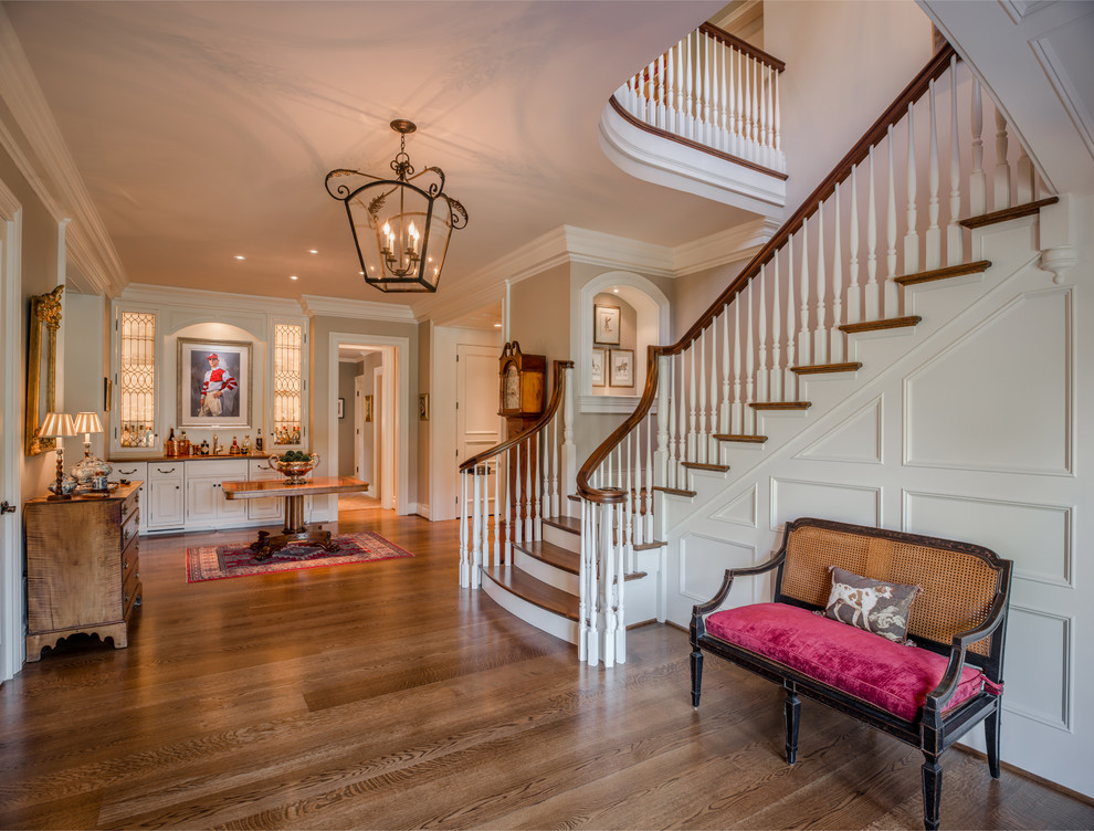 Design ideas for a large traditional wood l-shaped staircase in Philadelphia with painted wood risers.