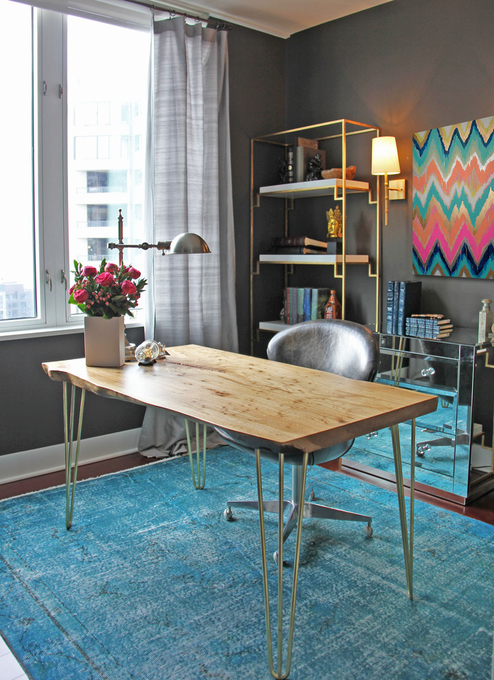 Small trendy freestanding desk dark wood floor home office photo in Seattle with gray walls