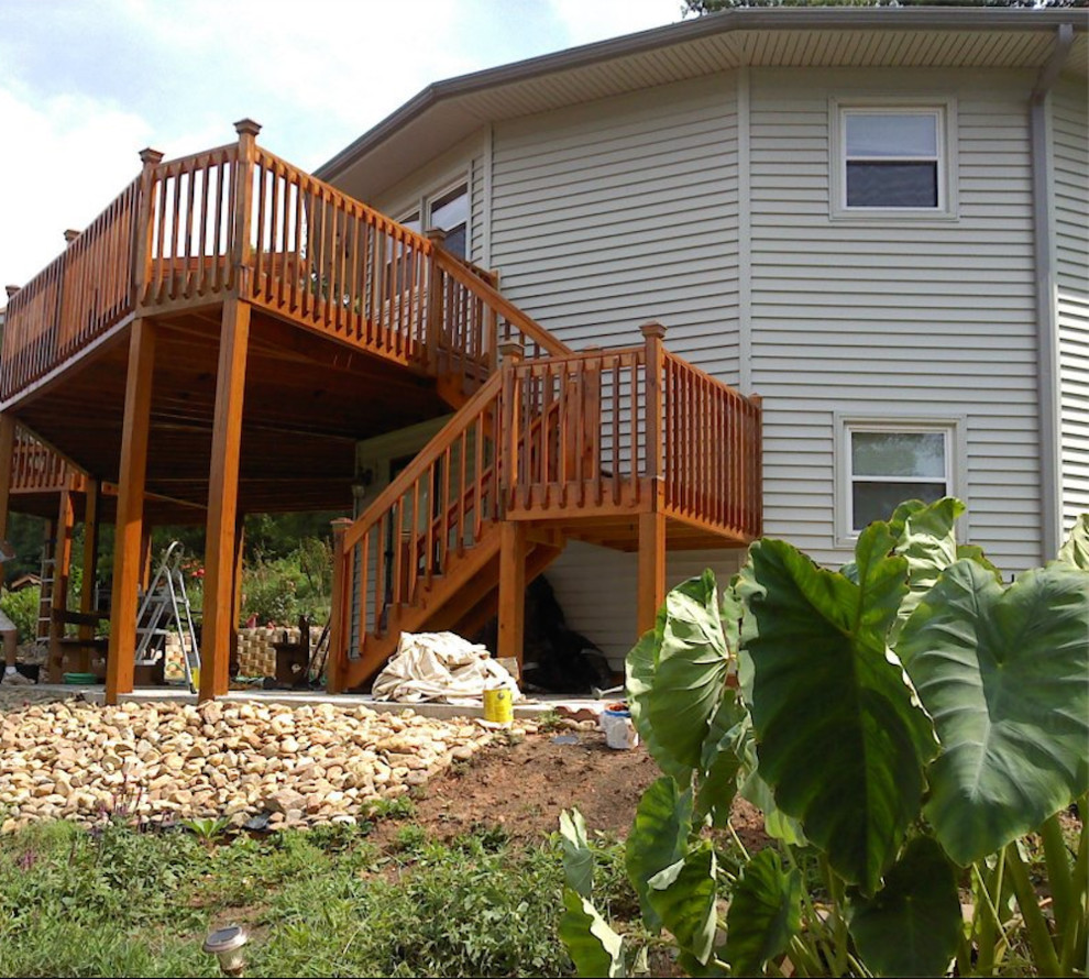 Mid-sized transitional side yard balcony deck photo in Charlotte with no cover