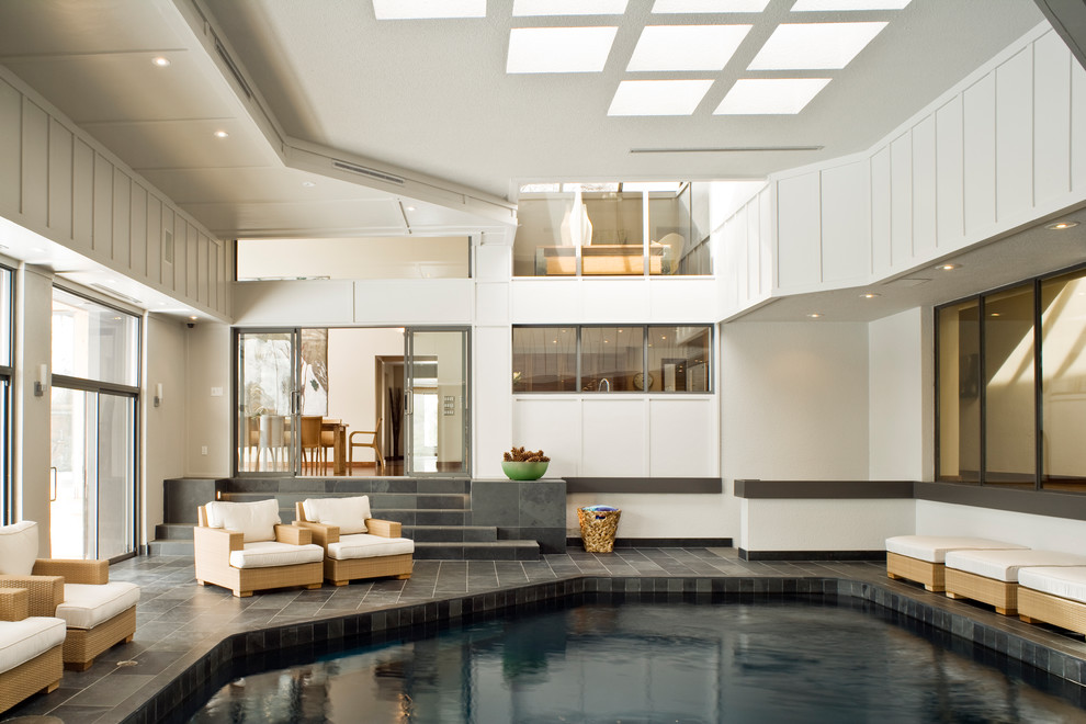 Transitional indoor tile and custom-shaped pool photo in Toronto