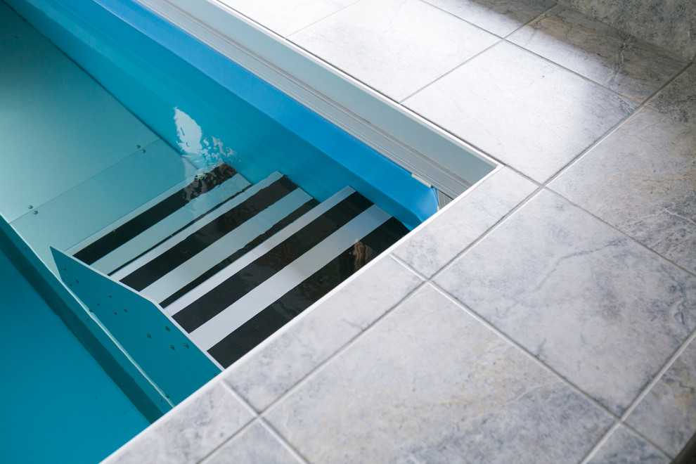 Inspiration for a mid-sized transitional indoor tile and rectangular lap pool house remodel