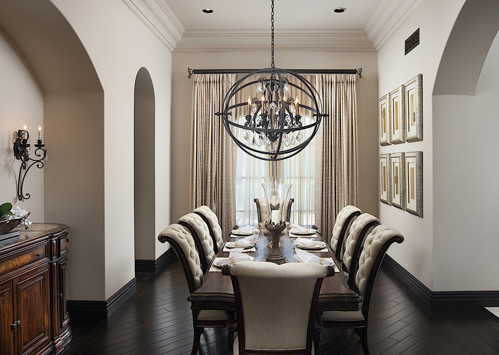 This is an example of an expansive contemporary separate dining room in Phoenix with beige walls, dark hardwood floors, no fireplace and brown floor.