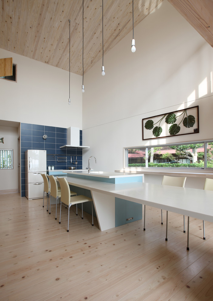 Design ideas for a contemporary open plan dining in Tokyo Suburbs with white walls, light hardwood floors and beige floor.