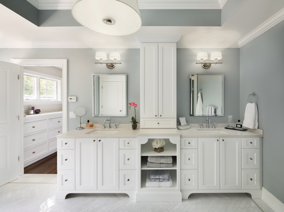 Freestanding bathtub - large transitional master white tile and stone tile marble floor freestanding bathtub idea in New York with an undermount sink, recessed-panel cabinets, white cabinets, quartz countertops, a one-piece toilet and gray walls