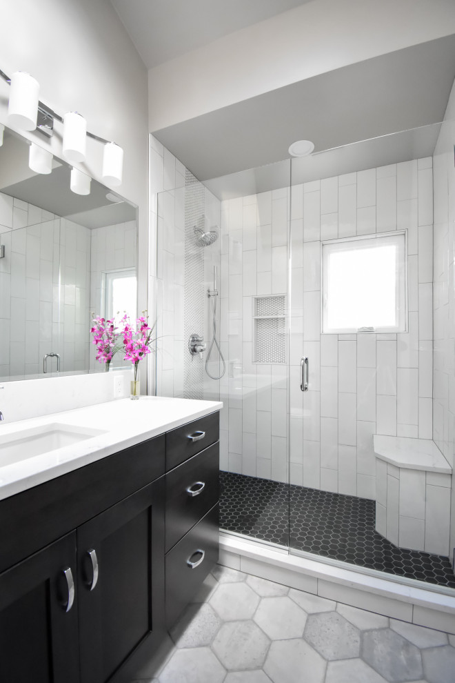 Example of a mid-sized minimalist master white tile and porcelain tile porcelain tile, gray floor and single-sink alcove shower design in Portland with shaker cabinets, black cabinets, a two-piece toilet, gray walls, an undermount sink, quartz countertops, a hinged shower door, white countertops and a built-in vanity