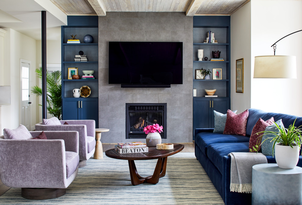 Contemporary open concept living room in DC Metro with blue walls, a standard fireplace, a tile fireplace surround, wood and wallpaper.