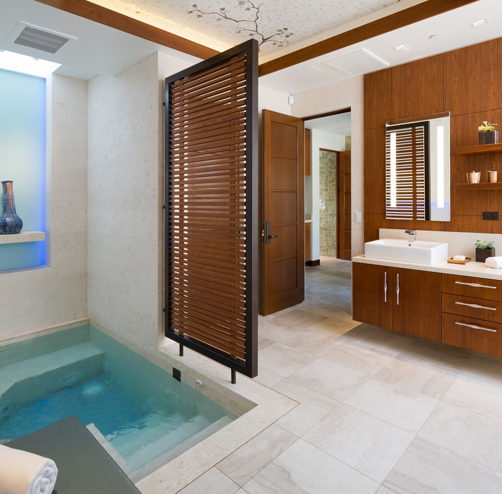 Design ideas for a tropical bathroom in San Diego with flat-panel cabinets, a hot tub, a vessel sink, beige floor and white benchtops.