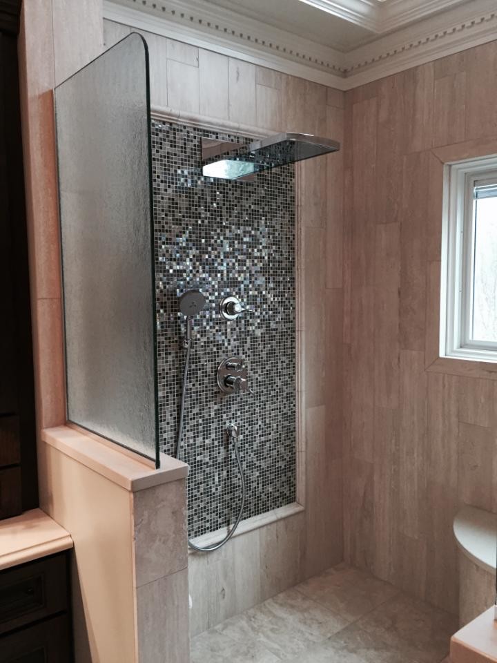 Mid-sized transitional master travertine floor and beige floor open shower photo with shaker cabinets, brown cabinets, beige walls, an undermount sink and quartz countertops