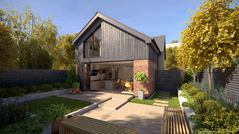 This is an example of a small modern two-storey multi-coloured house exterior in Hertfordshire with wood siding, a gable roof, a tile roof, a grey roof and board and batten siding.