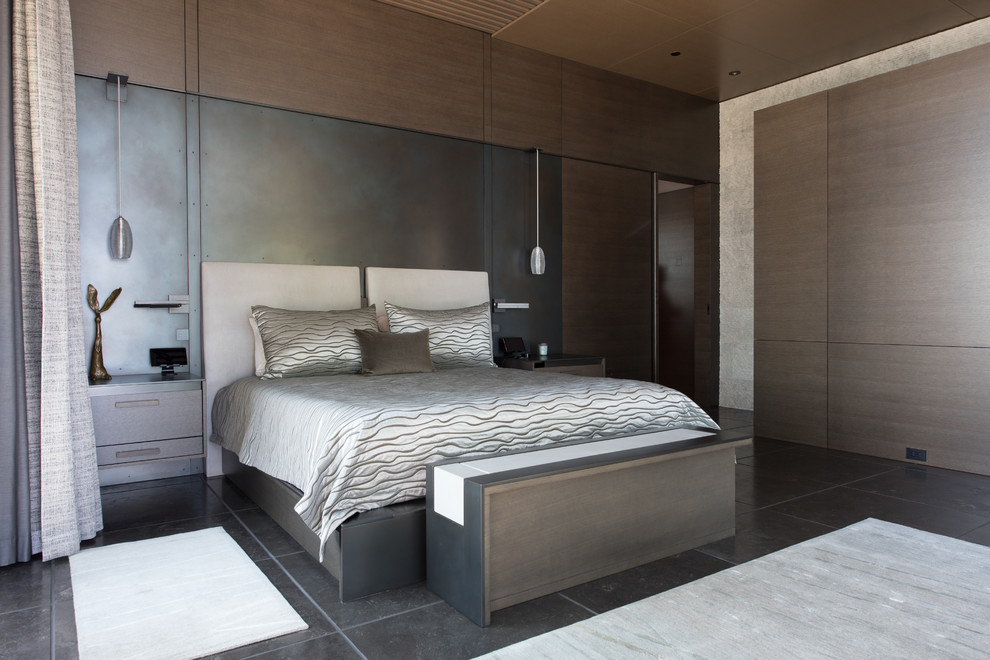 Design ideas for a large contemporary master bedroom in Seattle with black walls, no fireplace, grey floor and concrete floors.