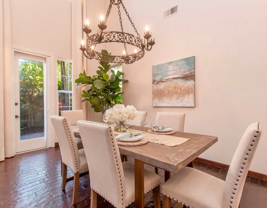 Large transitional open plan dining in San Diego with white walls, dark hardwood floors and brown floor.