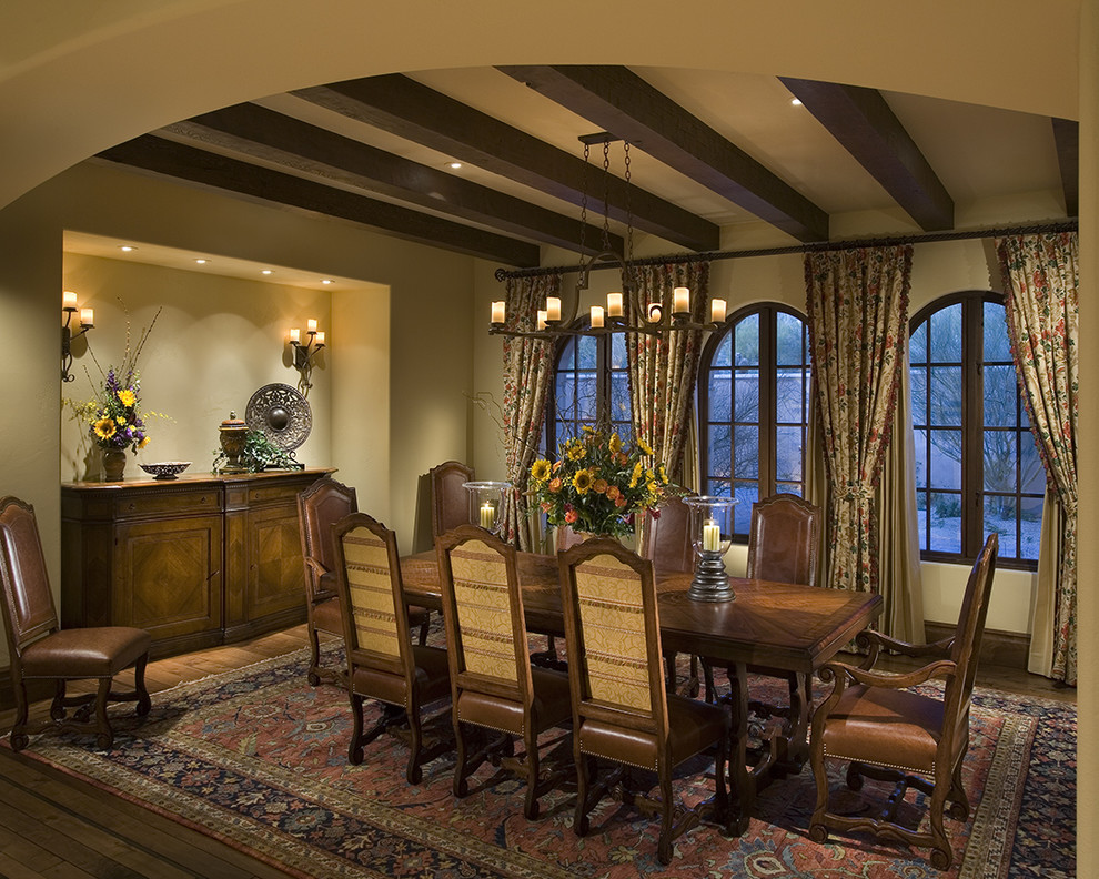 Photo of a country dining room in Phoenix with beige walls and dark hardwood floors.