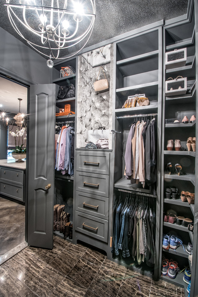 This is an example of a large transitional gender-neutral walk-in wardrobe in Other with shaker cabinets and grey cabinets.