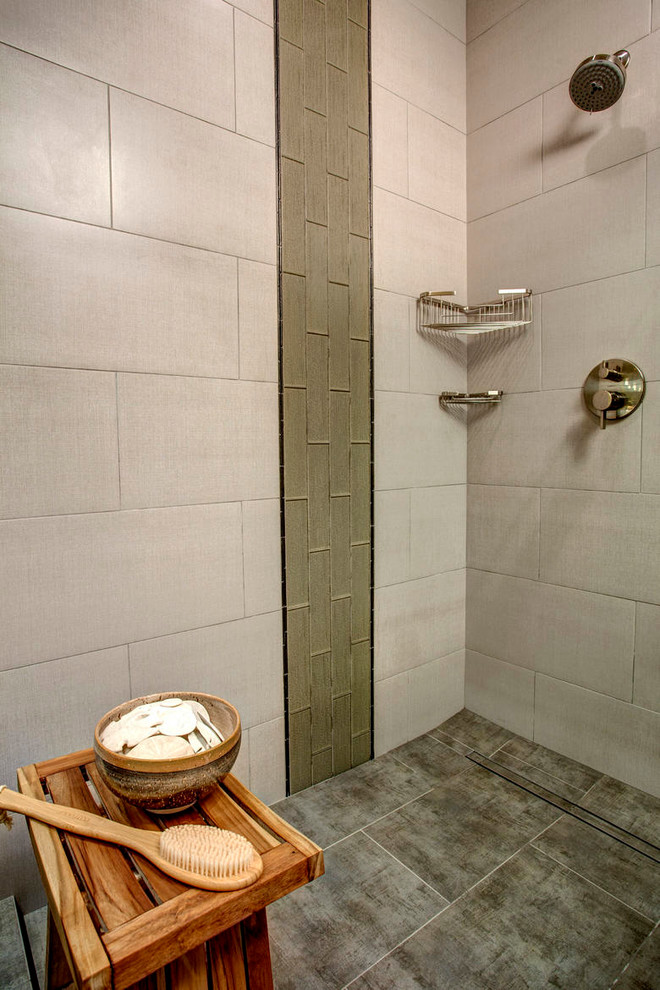 Photo of a large modern master bathroom in Seattle with an undermount sink, flat-panel cabinets, medium wood cabinets, engineered quartz benchtops, a corner shower, a two-piece toilet, gray tile, stone tile, yellow walls and porcelain floors.