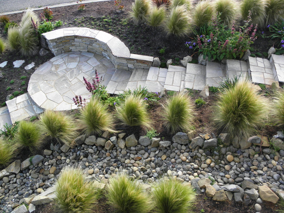 Design ideas for a mediterranean full sun garden in San Luis Obispo with natural stone pavers.
