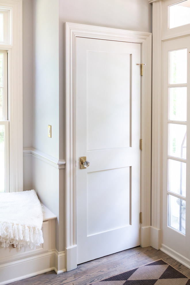Elegant Entryway with White Door and Natural Light