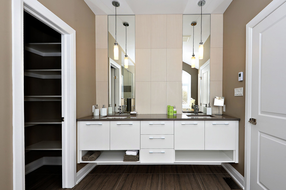 Design ideas for a mid-sized transitional master bathroom in Ottawa with flat-panel cabinets, white cabinets, beige tile, porcelain tile, beige walls, porcelain floors, an undermount sink, engineered quartz benchtops and brown floor.