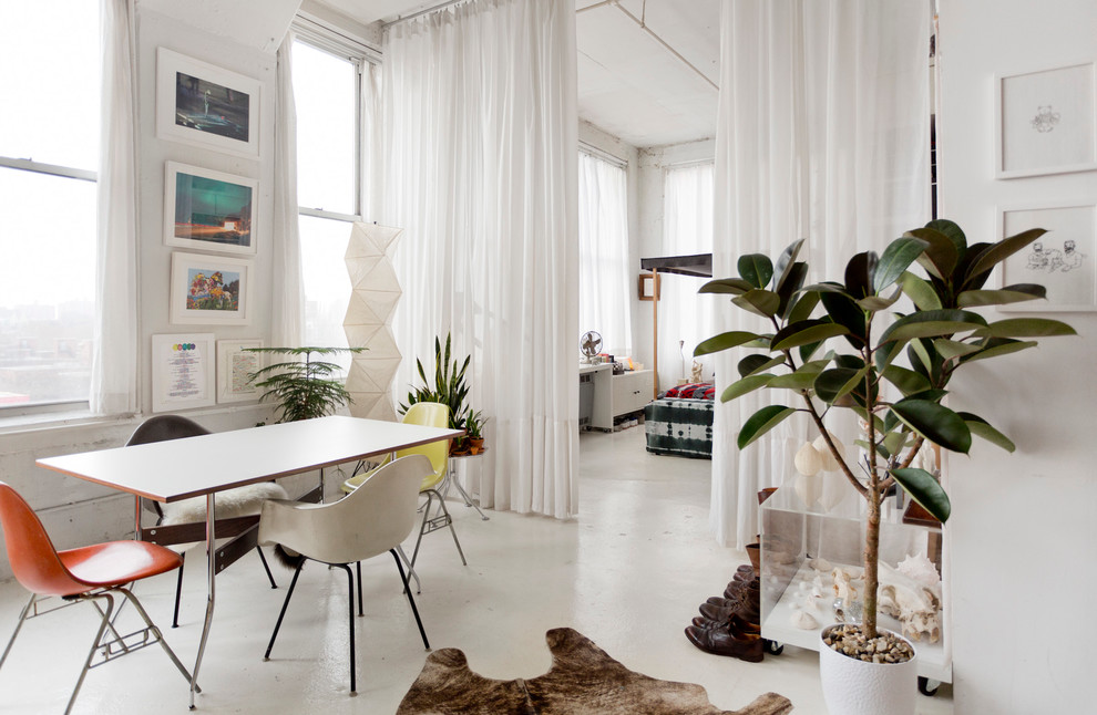 Photo of an eclectic dining room in New York with white walls.