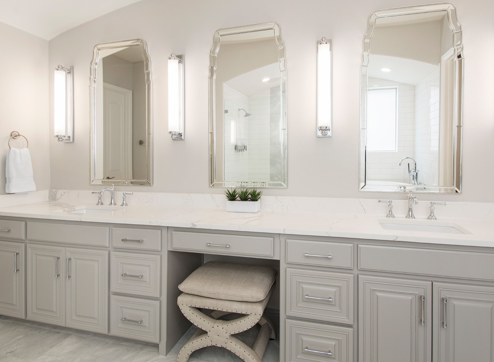 Inspiration for a mid-sized transitional master bathroom in Dallas with raised-panel cabinets, grey cabinets, a japanese tub, an open shower, a two-piece toilet, beige tile, ceramic tile, beige walls, marble floors, an undermount sink, engineered quartz benchtops, grey floor, an open shower and white benchtops.